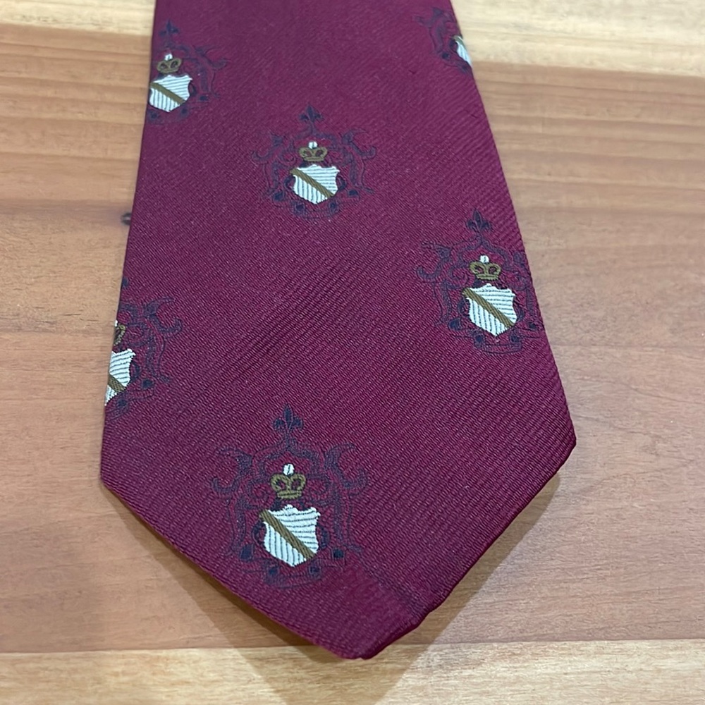Red tie with coat of arms